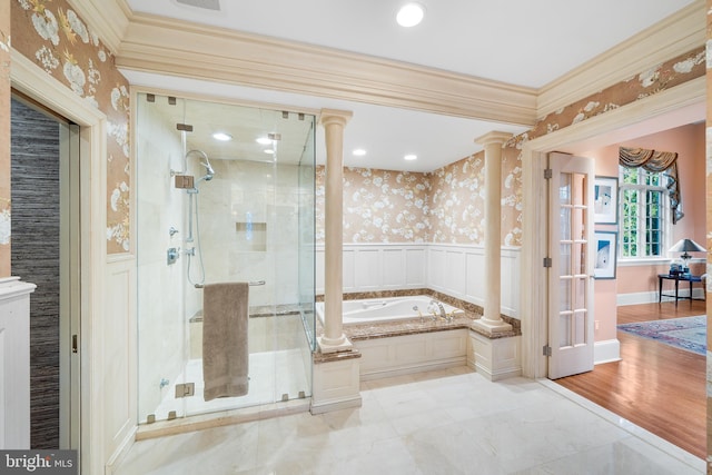 bathroom featuring ornate columns, ornamental molding, and independent shower and bath