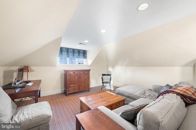 carpeted living room with lofted ceiling