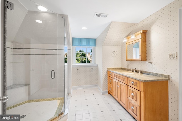 bathroom featuring vanity and walk in shower