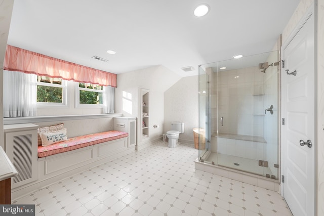 bathroom featuring walk in shower and toilet