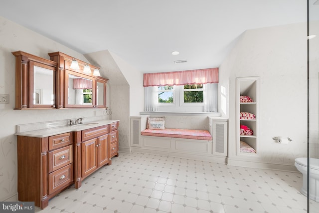 bathroom with vanity and toilet