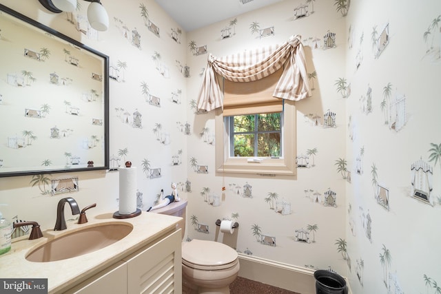 bathroom with vanity and toilet