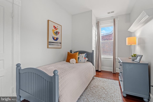 bedroom featuring dark wood-type flooring