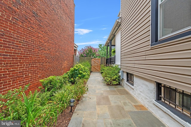 view of side of home featuring a patio area