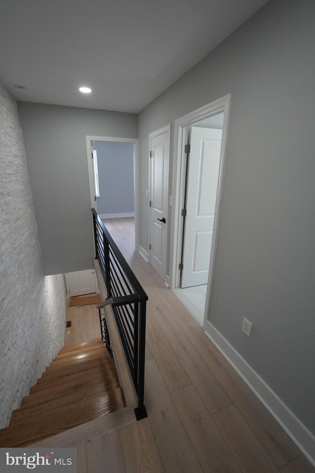 stairway featuring hardwood / wood-style floors