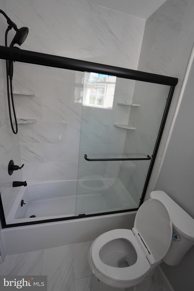 bathroom featuring enclosed tub / shower combo