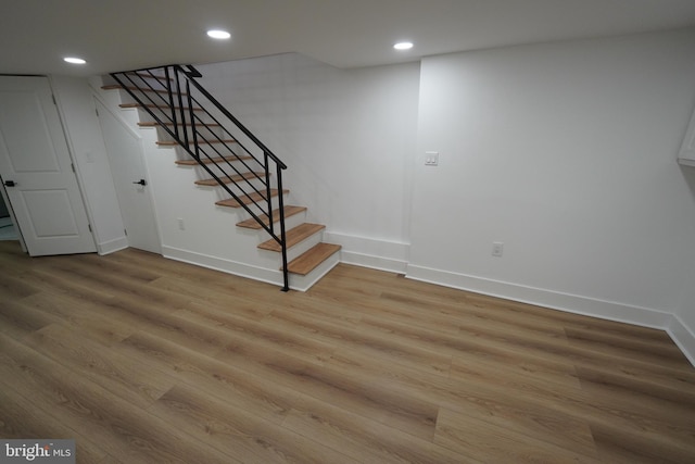 basement featuring hardwood / wood-style flooring