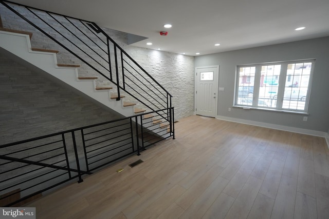 foyer with wood-type flooring