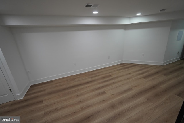 basement featuring hardwood / wood-style floors