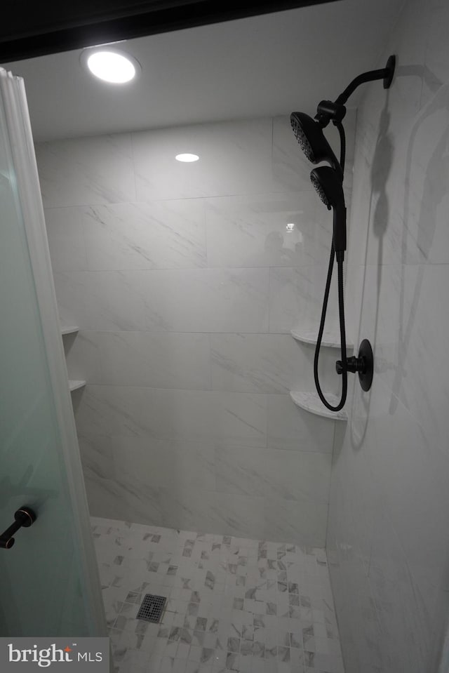 details with a tile shower