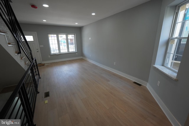 unfurnished living room with light hardwood / wood-style flooring