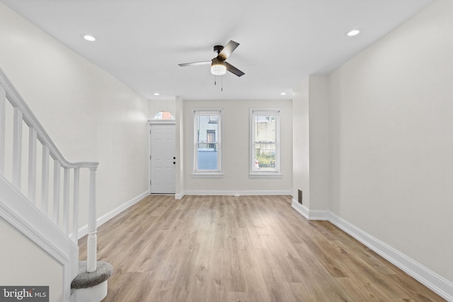 foyer with light wood-type flooring and ceiling fan