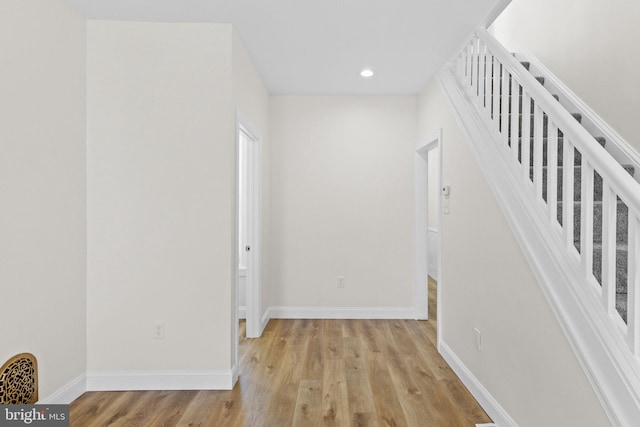 corridor with light wood-type flooring