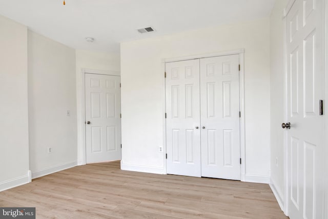 unfurnished bedroom featuring light hardwood / wood-style floors