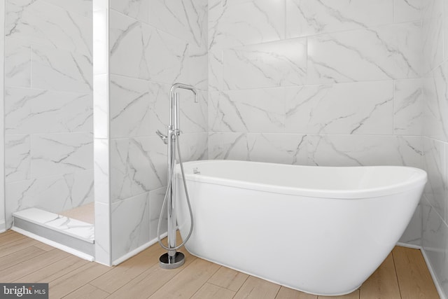 bathroom featuring a tub to relax in