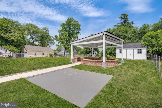 view of yard with basketball hoop and an outbuilding