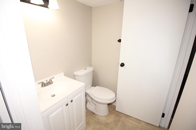 bathroom with tile patterned floors, toilet, and vanity