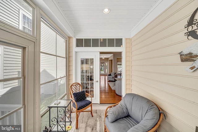 sunroom / solarium featuring french doors