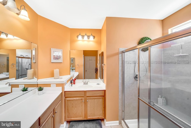 bathroom featuring vanity and an enclosed shower