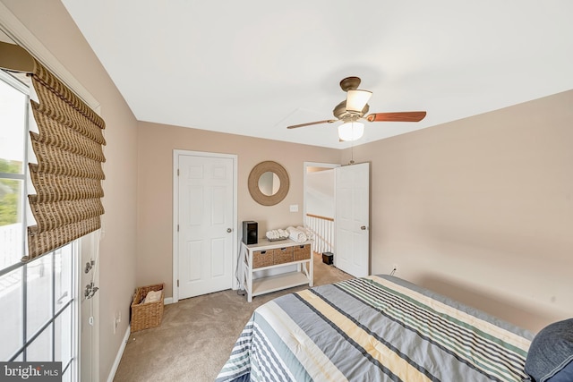 bedroom with light carpet and ceiling fan