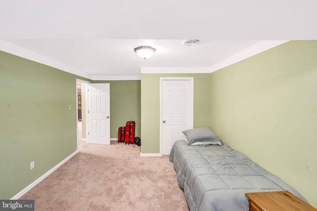 bedroom featuring light colored carpet