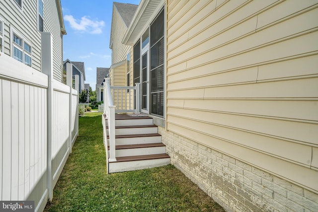 view of side of home featuring a lawn