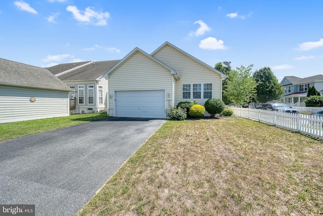 view of front of property with a front lawn and a garage