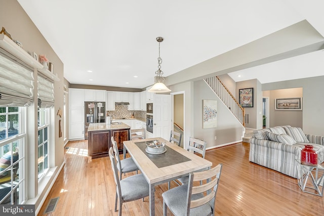 dining room featuring light hardwood / wood-style flooring