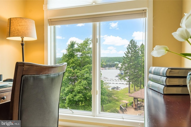 doorway to outside featuring a wealth of natural light and a water view