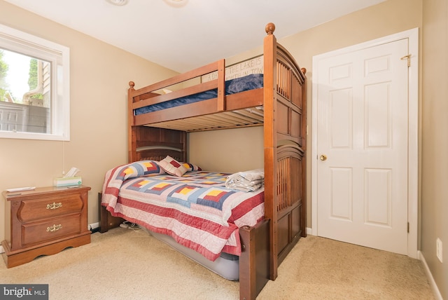 bedroom with light carpet