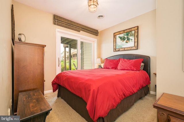 carpeted bedroom featuring access to exterior