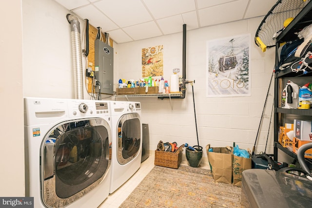 washroom with washer and clothes dryer and electric panel