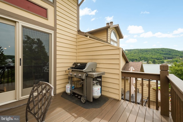 wooden terrace featuring area for grilling