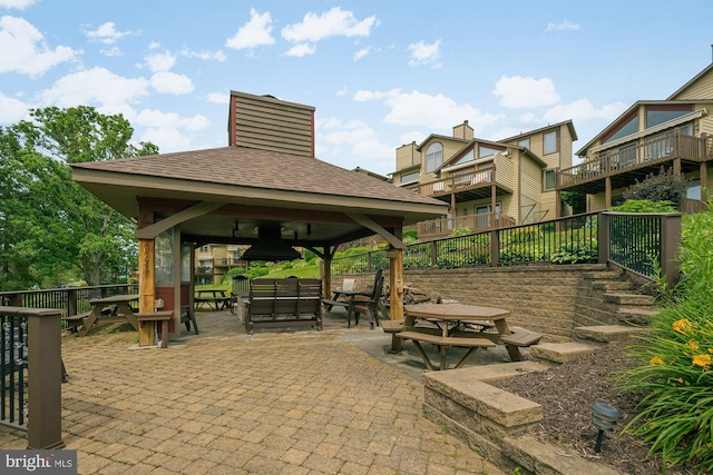 view of property's community with a gazebo and a patio area