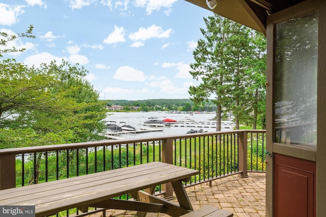 balcony featuring a water view