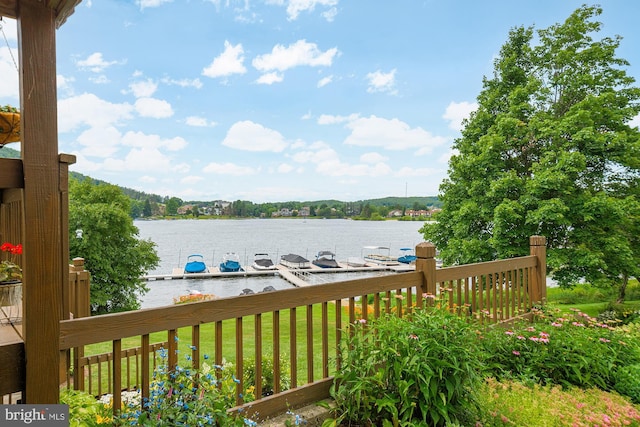 exterior space with a lawn and a water view