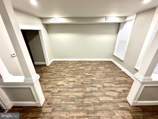 basement featuring wood-type flooring