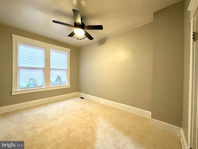 empty room featuring ceiling fan and carpet floors