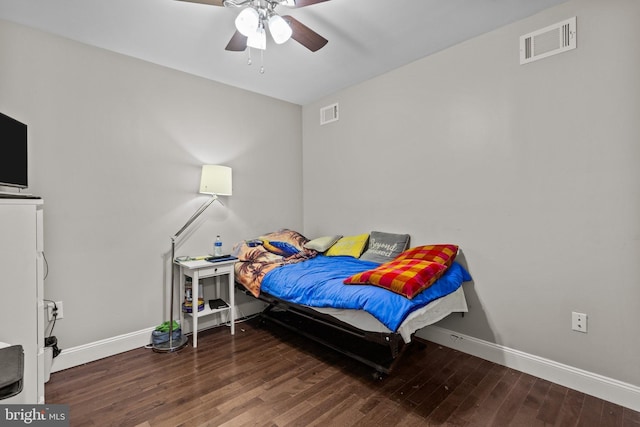 bedroom featuring dark hardwood / wood-style floors and ceiling fan