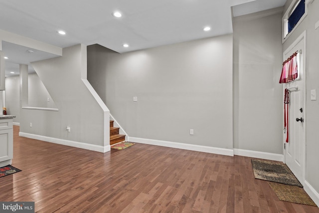 basement with hardwood / wood-style flooring