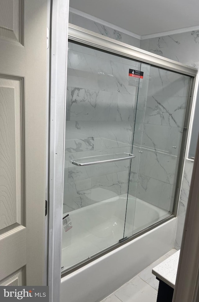 bathroom with vanity and bath / shower combo with glass door