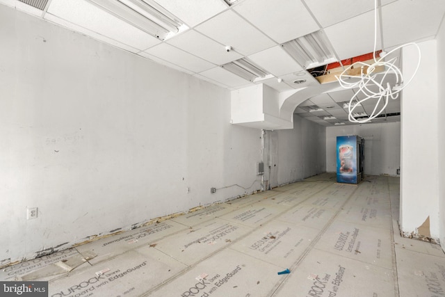 basement featuring a paneled ceiling