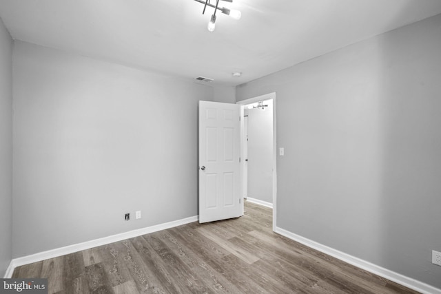 spare room featuring light hardwood / wood-style flooring