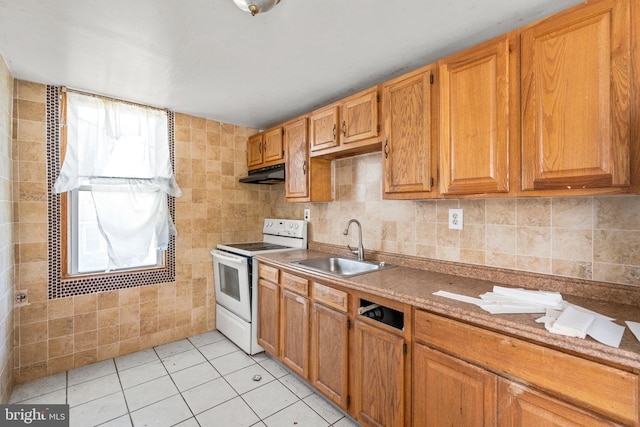 kitchen with white electric range, sink, and light tile patterned floors