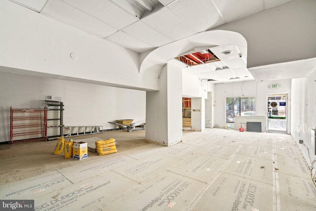 interior space with a paneled ceiling