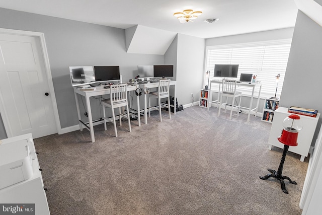 office space featuring carpet and vaulted ceiling