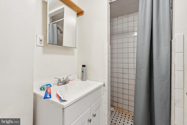 bathroom featuring vanity and walk in shower