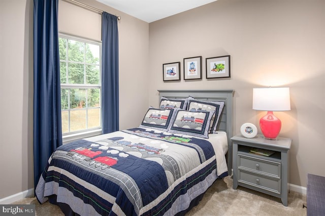 carpeted bedroom with multiple windows