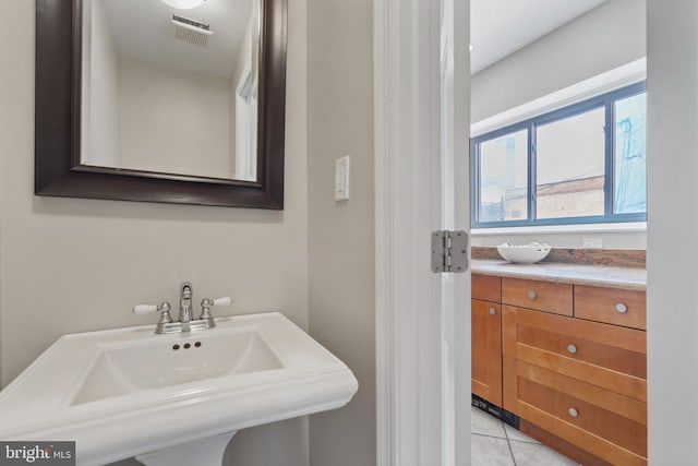 bathroom with tile patterned floors and sink