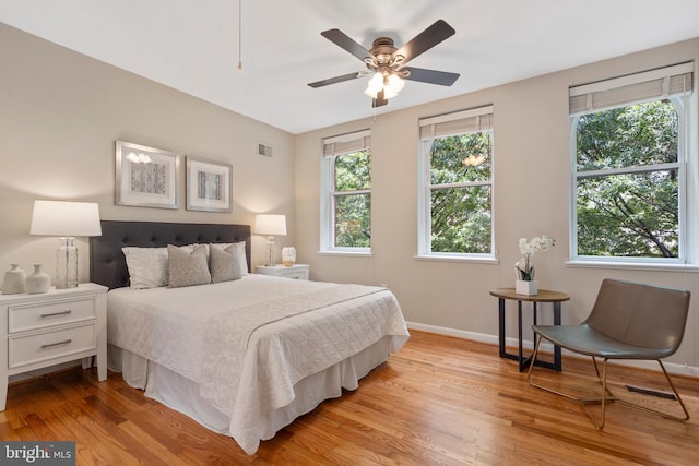 bedroom featuring ceiling fan and light hardwood / wood-style flooring